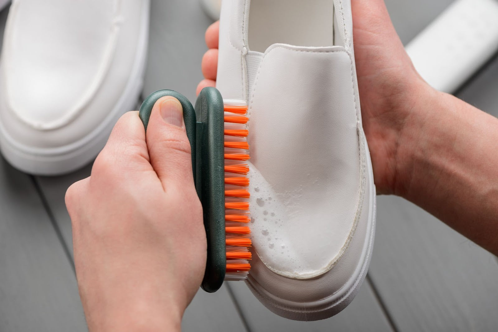 Cleaning tools to get yellow stains out of white shoes.