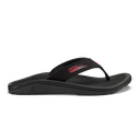 OluKai ‘Ohana sandals in black with red details, featuring a durable water-resistant strap and cushioned footbed, side view.