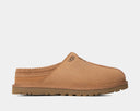 UGG Neuman slippers in chestnut brown suede with braided detailing, plush lining, and lugged rubber outsole, side view.