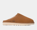 Brown UGG slipper on a light gray background