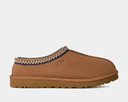 Brown UGG slipper on a light gray background