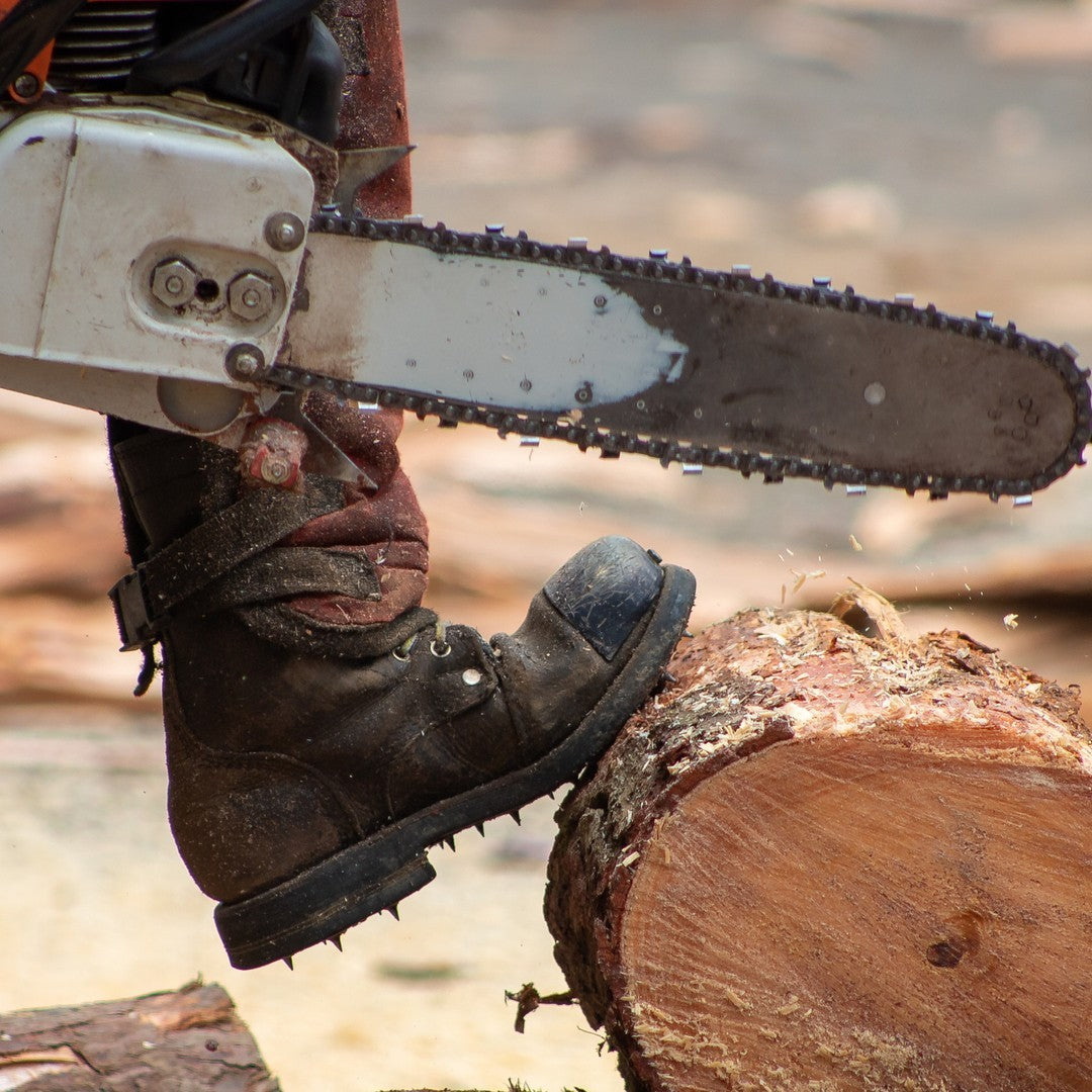 a logger wearing big shoes brand boots