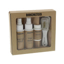 Birkenstock Deluxe Shoe Care Kit featuring water and stain repellent, cleaner and refresher, cork sealer, and brush in beige packaging, front view.
