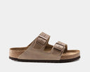 A pair of brown Birkenstock Arizona soft footbed sandals with oiled leather upper and two adjustable straps.