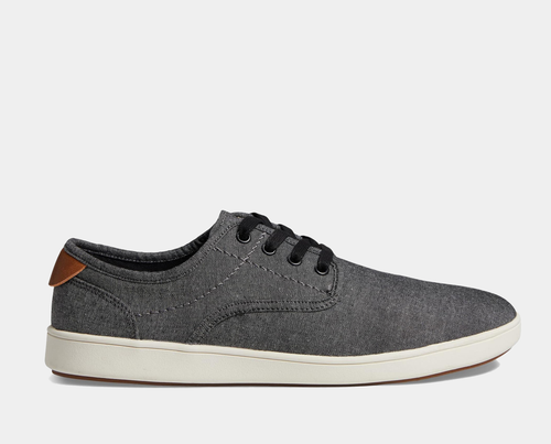 Steve Madden Fenta casual sneakers in gray fabric with black laces, brown heel accent, and white rubber sole, side view.