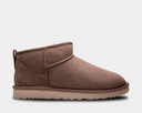 A brown UGG Classic Ultra Mini boot with a low shaft and a flat sole.