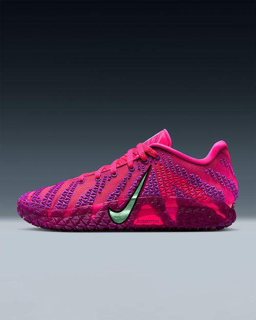Pink and purple sneaker with a green Nike logo on a gray background