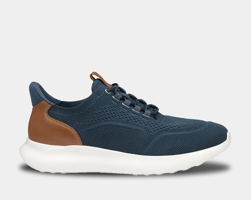 Johnston & Murphy Amherst 2.0 Knit Plain Toe shoes in navy blue knit material with tan leather heel accents and white sole, side view.