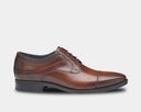 Johnston & Murphy Gibbons Cap Toe dress shoes in polished brown leather with cap toe detail and lace-up closure, side view.