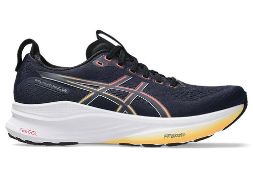 Navy running shoe with white sole on a white background