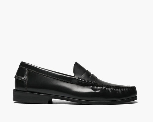 A black Moc Toe Penny Loafer with a smooth leather upper and a genuine leather sole.