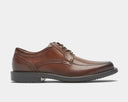 A brown Rockport men's oxford dress shoe with apron toe and lace-up closure.